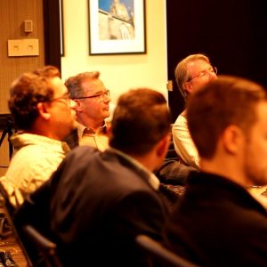 Muscle Trading Students in Boardroom